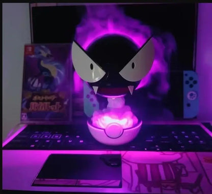 Lamp shaped like a character with glowing purple light on a desk.